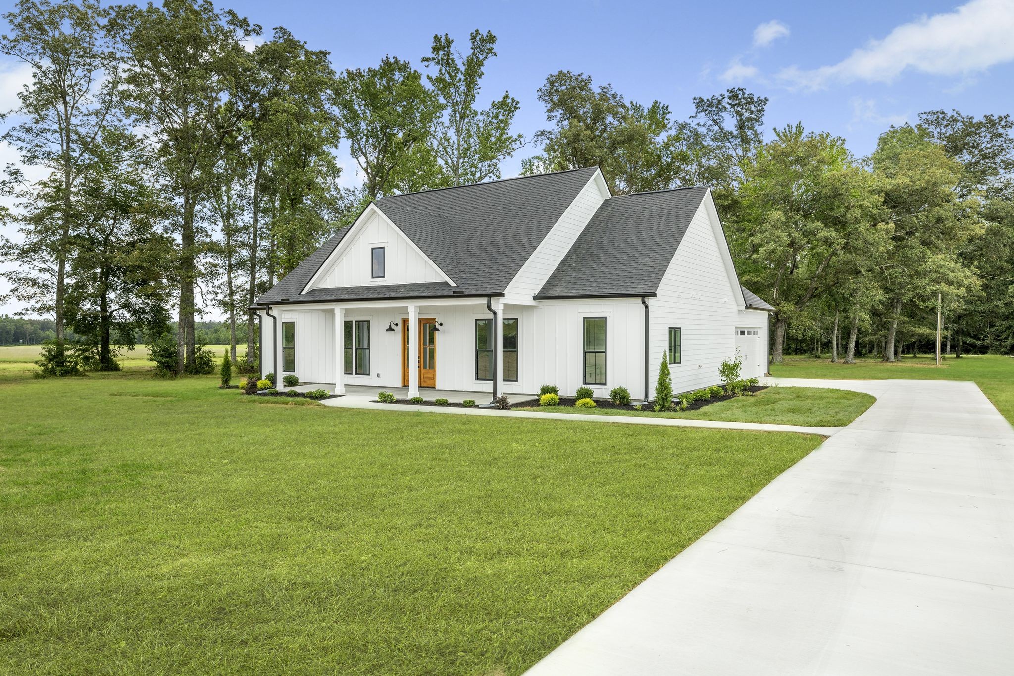 1694 McAfee Road Morrison, TN 37357 - Photo 3 of 41 a front view of a house with a garden