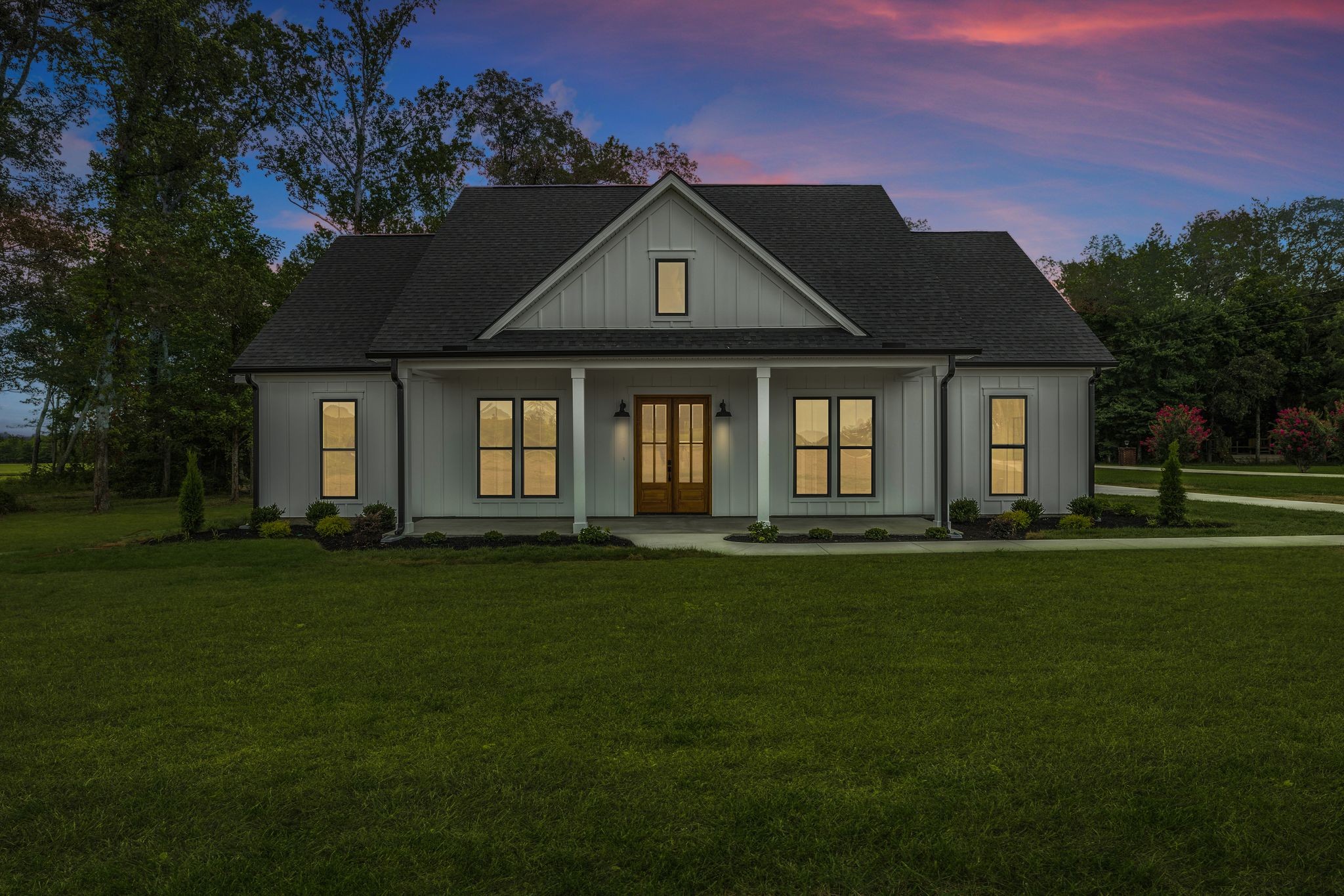 1694 McAfee Road Morrison, TN 37357 - Photo 36 of 41 a front view of a house with a garden