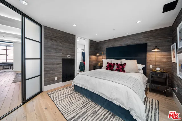 a bedroom with a bed and a walk in closet