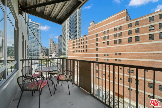 a view of a balcony with chairs