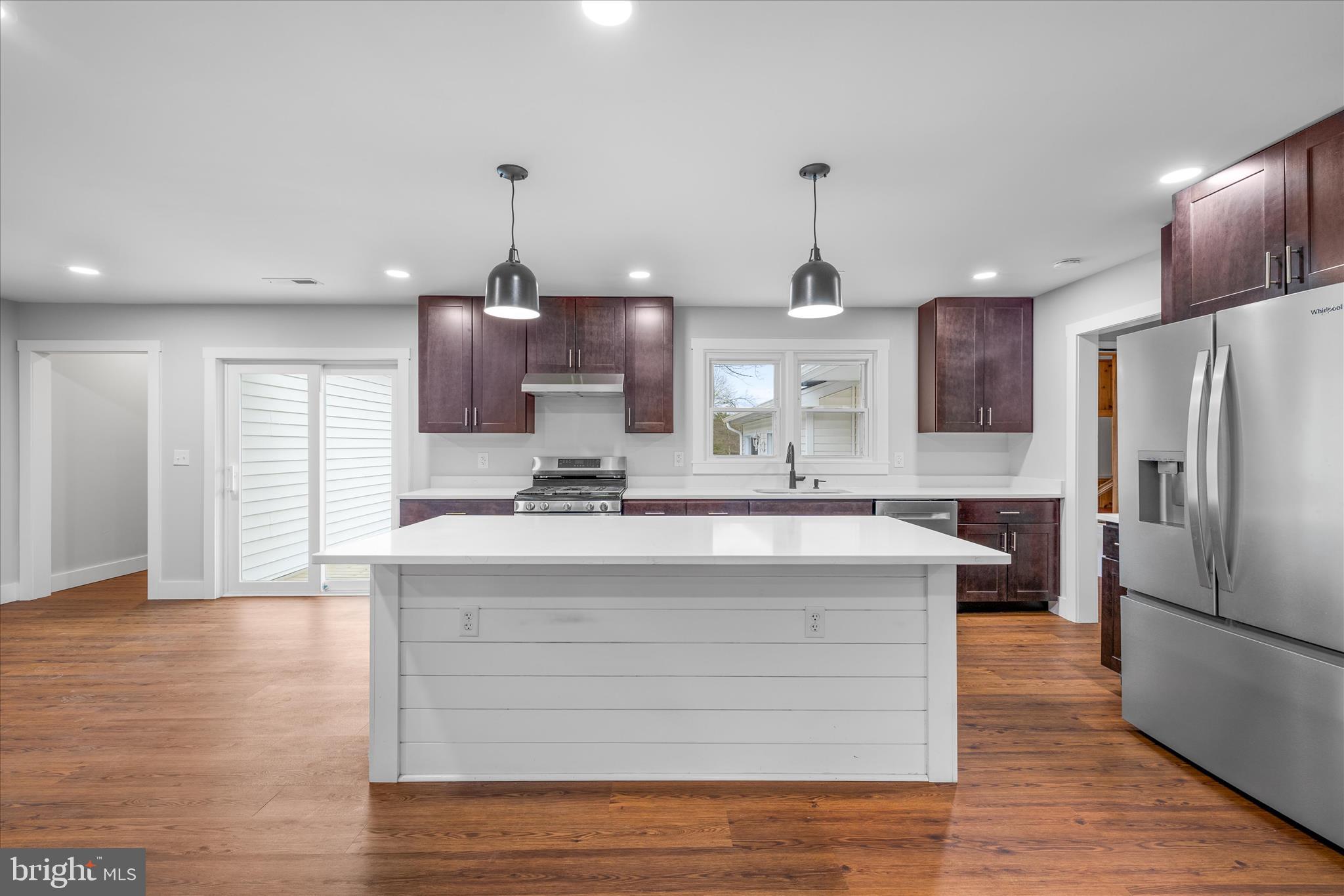 24163 Old Meadow Road Seaford, DE 19973 - Photo 15 of 98 Spacious kitchen with island and pendant lighting
