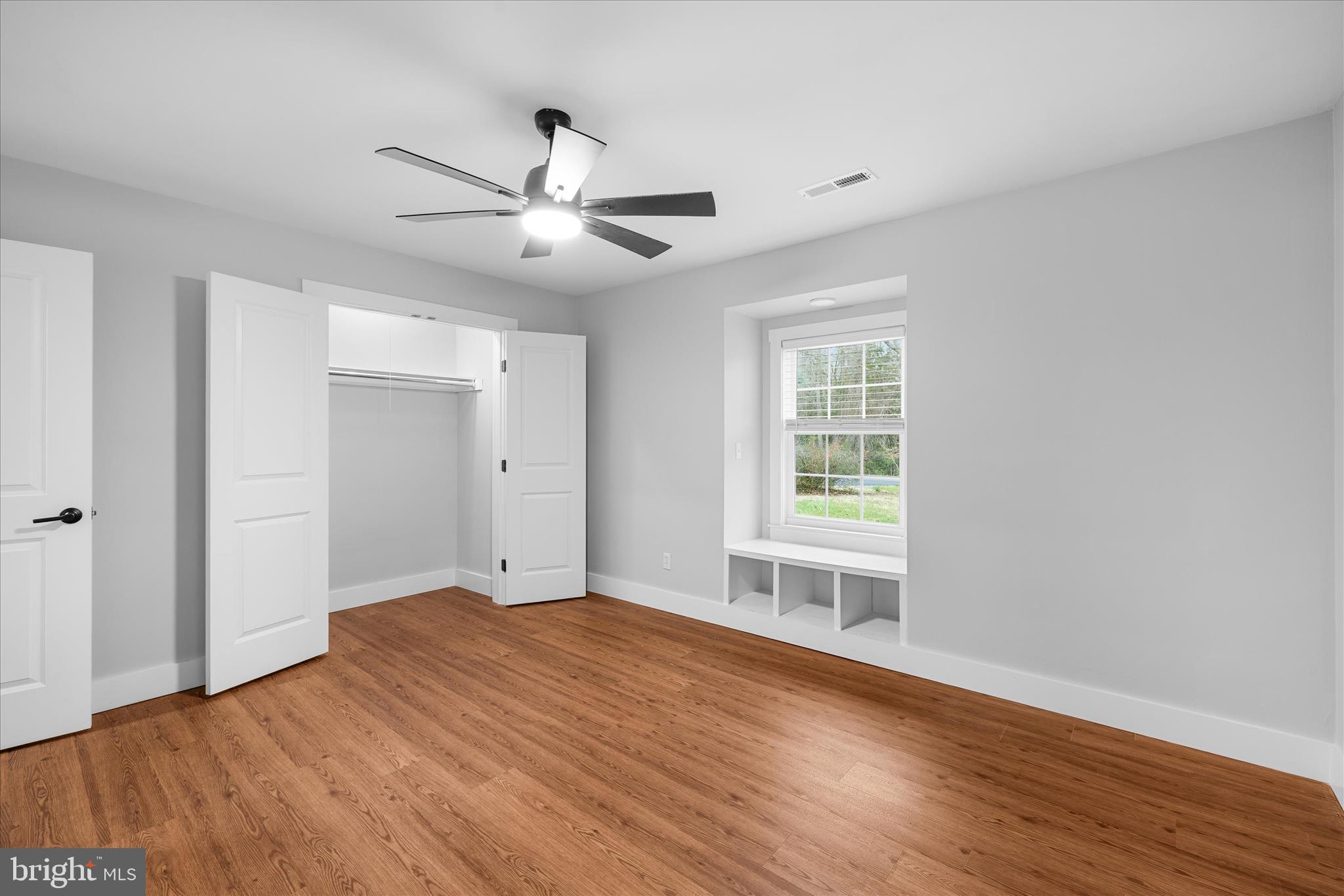 24163 Old Meadow Road Seaford, DE 19973 - Photo 35 of 98 Bedroom 3 with hardwood floors and window nook