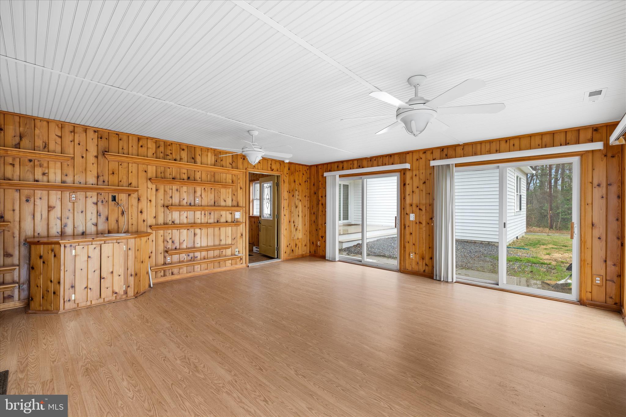 24163 Old Meadow Road Seaford, DE 19973 - Photo 46 of 98 Bright sunroom with sliding doors and views