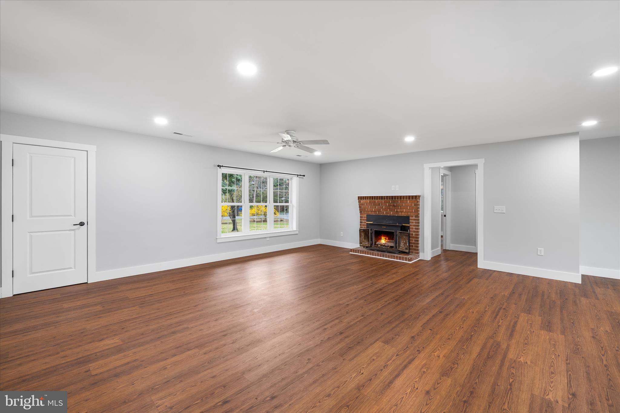 24163 Old Meadow Road Seaford, DE 19973 - Photo 8 of 98 Large living area with fireplace and natural light