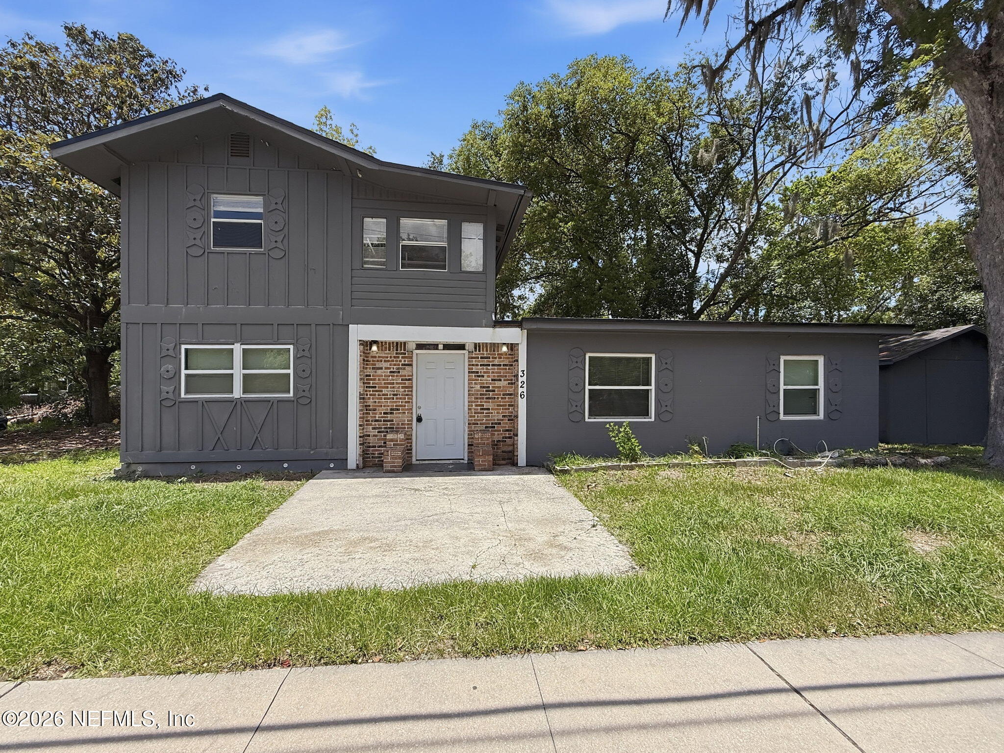 326 Cahoon Road South Jacksonville, FL 32220 - Photo 1 of 34 a front view of a house with garden