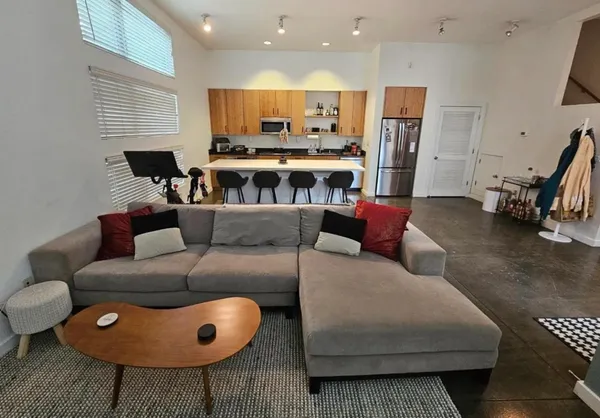 a living room with furniture and a rug