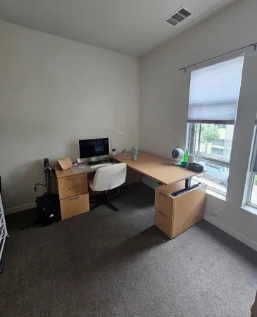 a room with furniture and window