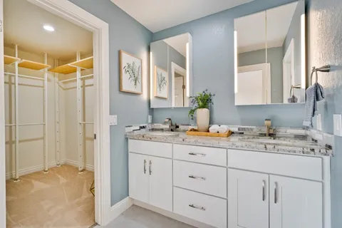 an aerial view of residential house with green space