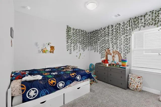 a room with toys and dresser