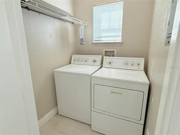 an aerial view of a house with outdoor space