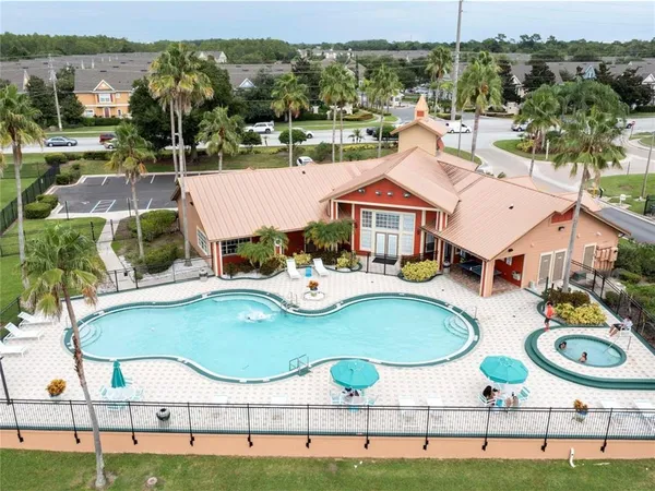 a view of a swimming pool with a patio