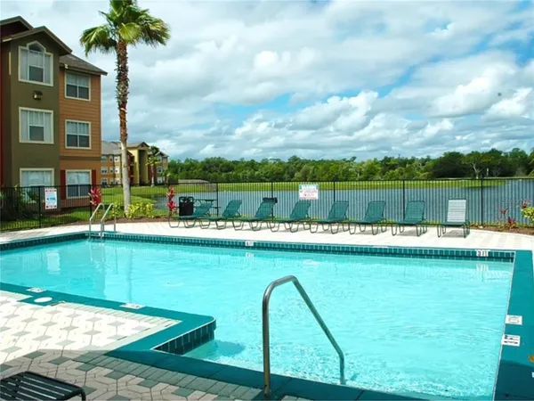 a view of a fountain in front of a house