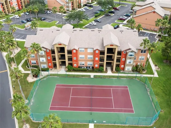 an aerial view of a house with swimming pool