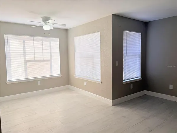 a view of an empty room with a window