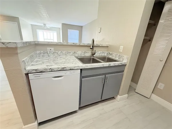 a utility room with a sink a washer and dryer