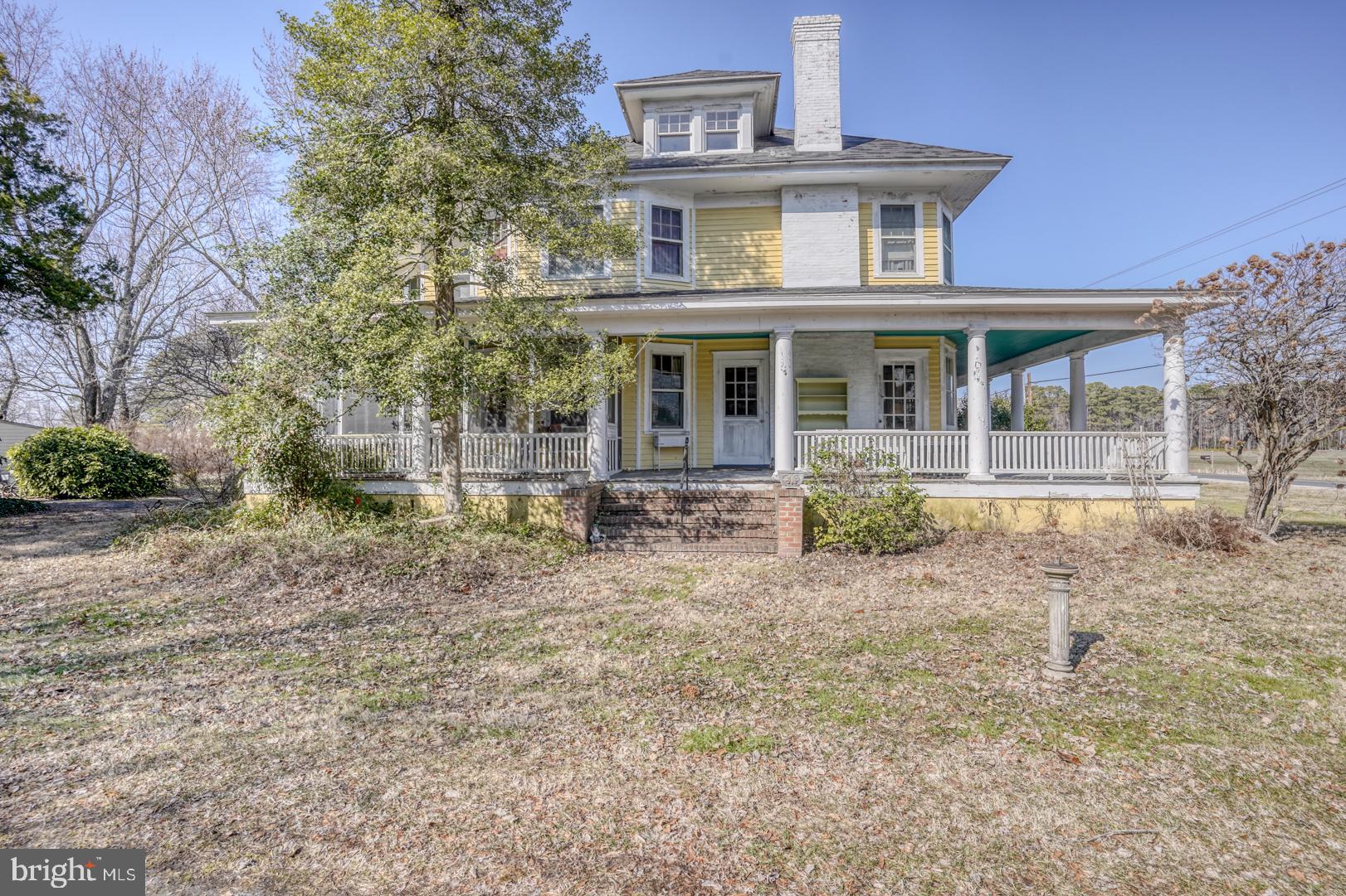 4096 Main Street Trappe, MD 21673 - Photo 15 of 70 a front view of a house with garden
