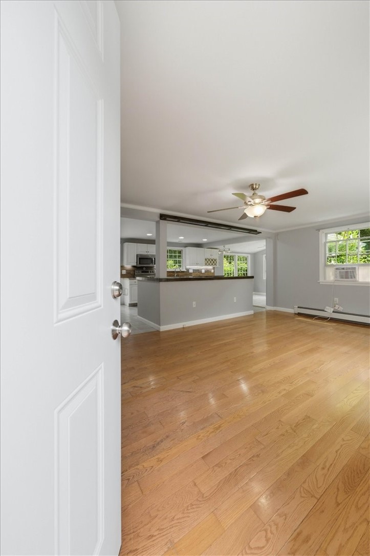 214 Anan Wade Road Glocester, RI 02857 - Photo 9 of 50 The home’s main living spaces offer an open, easy-flowing layout designed for both everyday living and entertaining.