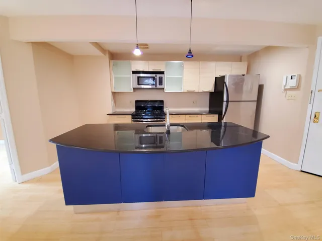 a view of kitchen with refrigerator sink