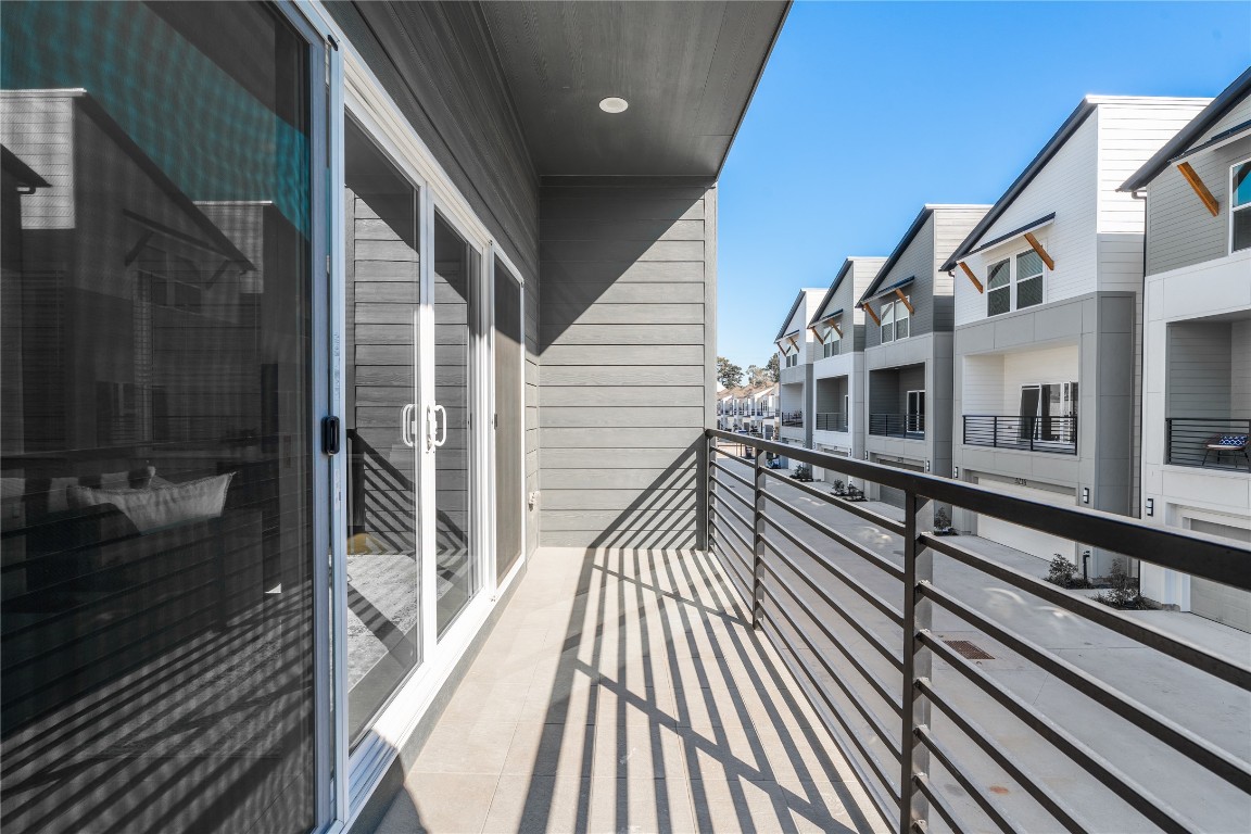 4710 Moving Meadows Houston, TX 77018 - Photo 18 of 42 With plenty of room to unwind, this covered balcony lets you enjoy the outdoors no matter the weather, whether you’re reading, lounging, or having company over.
