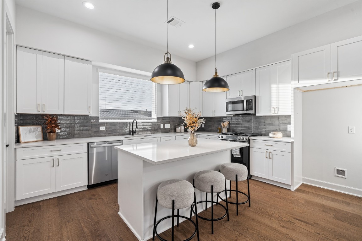 4710 Moving Meadows Houston, TX 77018 - Photo 19 of 42 This generous kitchen offers abundant counter space and storage, making it ideal for family gatherings and everyday essentials.