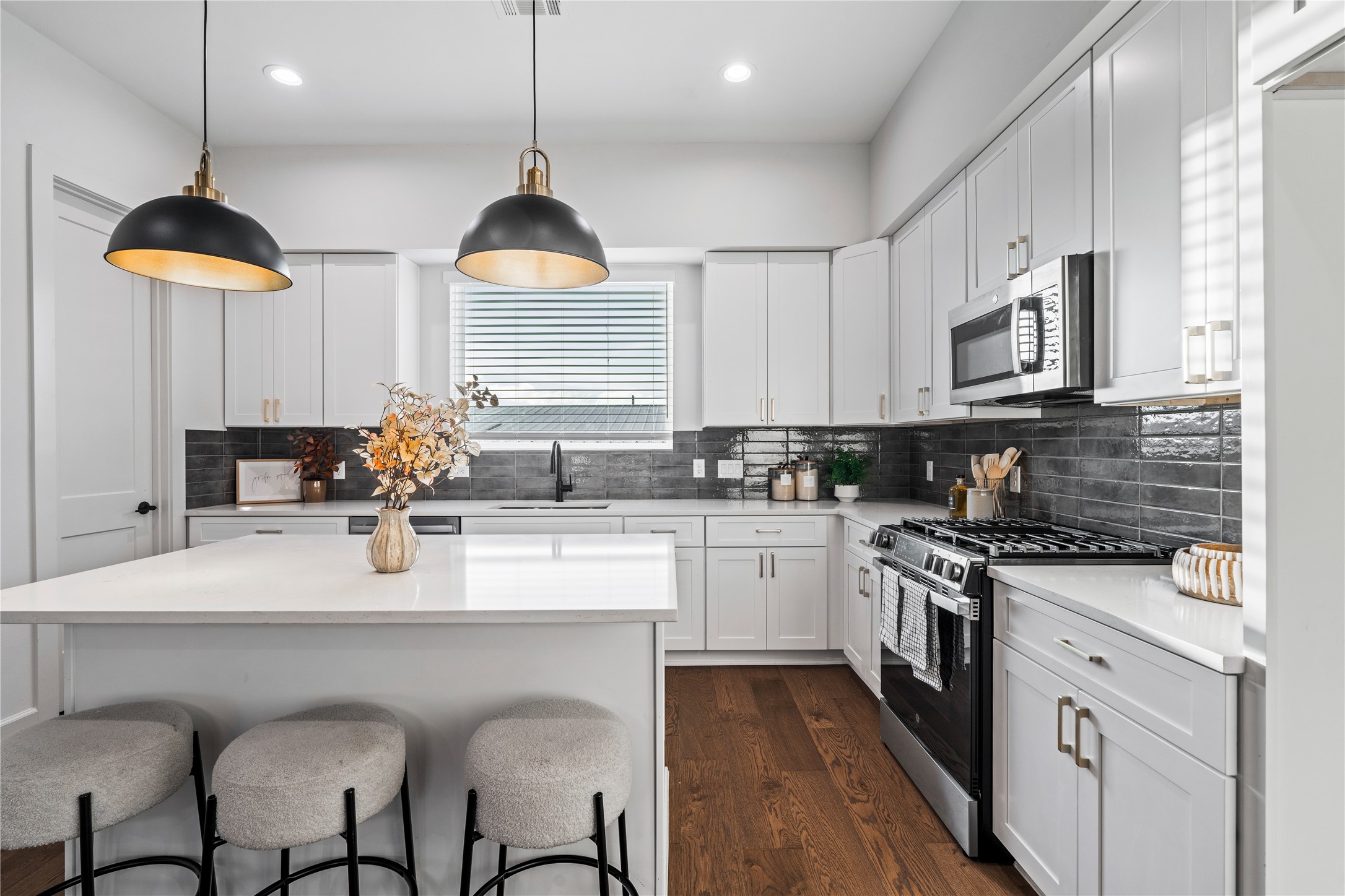 4710 Moving Meadows Houston, TX 77018 - Photo 21 of 42 a kitchen with stainless steel appliances granite countertop a stove a sink and a refrigerator