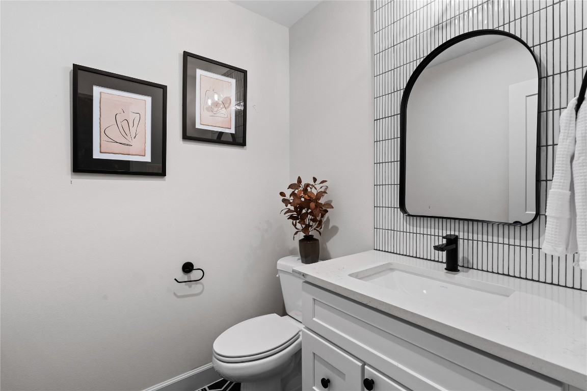 4710 Moving Meadows Houston, TX 77018 - Photo 26 of 42 The powder room sits conveniently along the staircase, making it easily accessible for guests.