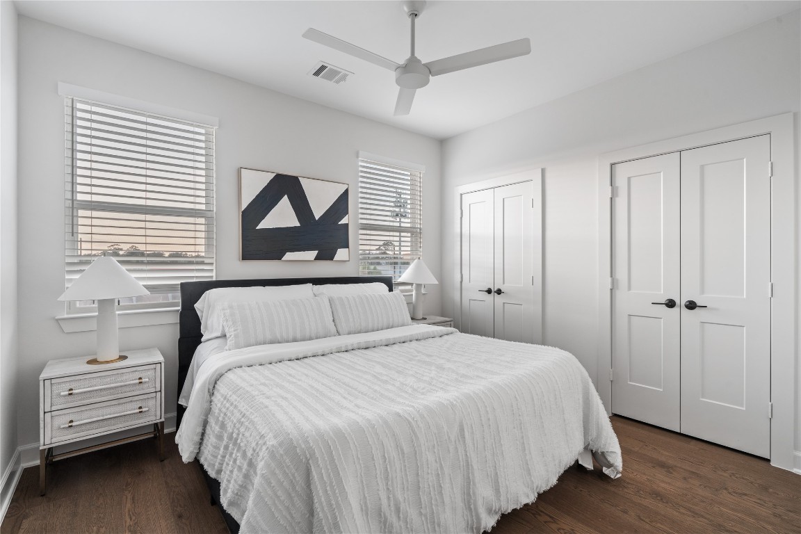 4710 Moving Meadows Houston, TX 77018 - Photo 33 of 42 The upstairs secondary bedroom offers great flexibility, whether you use it as a guest room or an office. Its size and layout make it easy to set up for work, relaxation, or hosting visitors without feeling cramped.