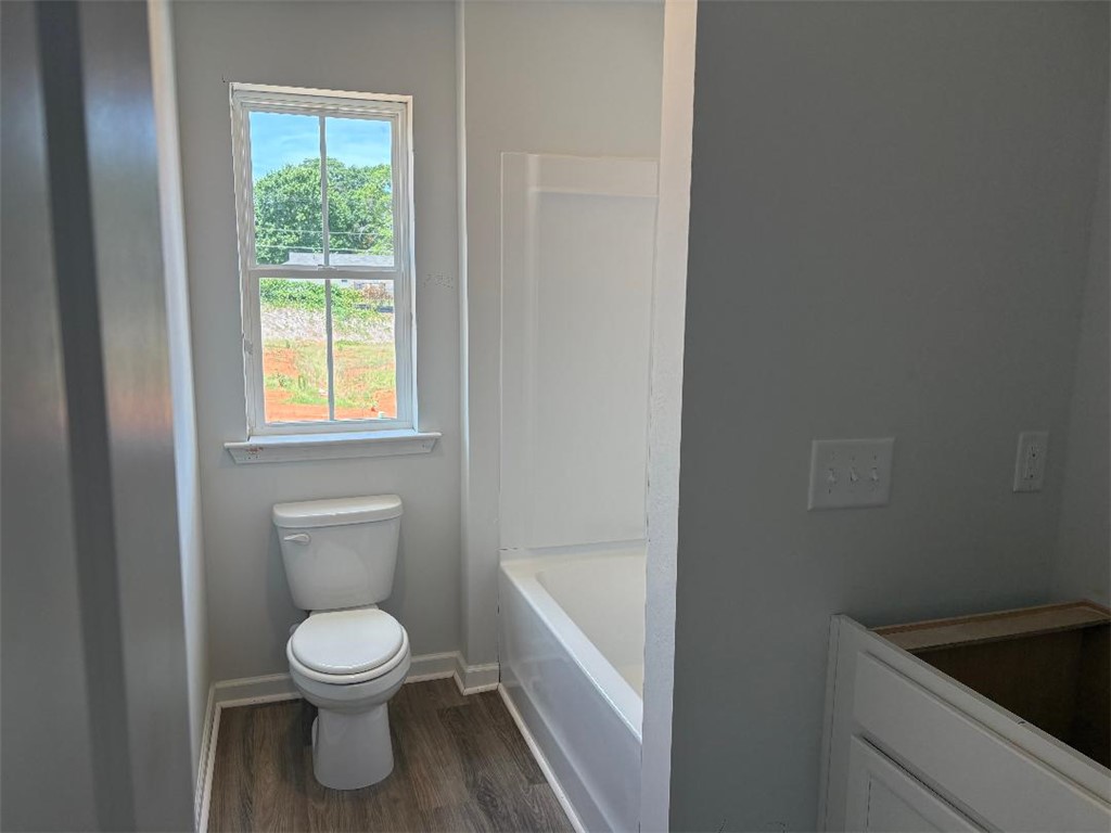 129 Cedar Shoals Easley, SC 29640 - Photo 21 of 31 A well-lit bathroom features durable vinyl flooring and a window offering abundant natural light.