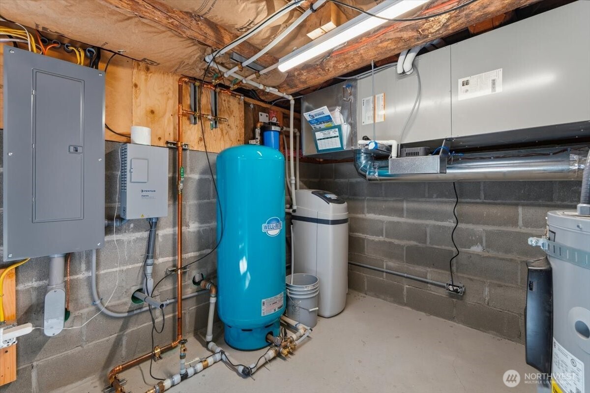 2350 First Crk Road Chelan, WA 98816 - Photo 27 of 39 a utility room with water heater and racks