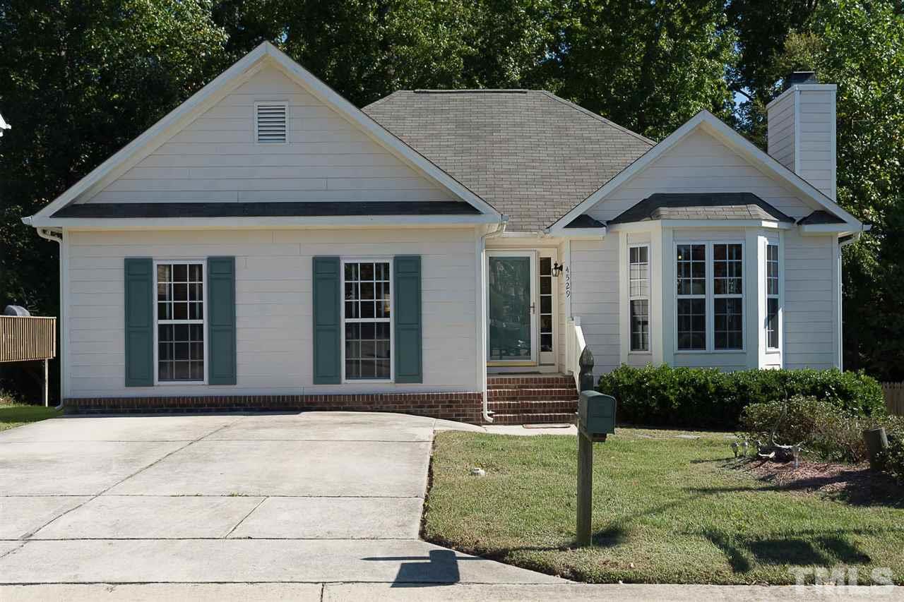 4529 Moss Spring Drive Raleigh, NC 27616 - Photo 1 of 21 a front view of a house with garden