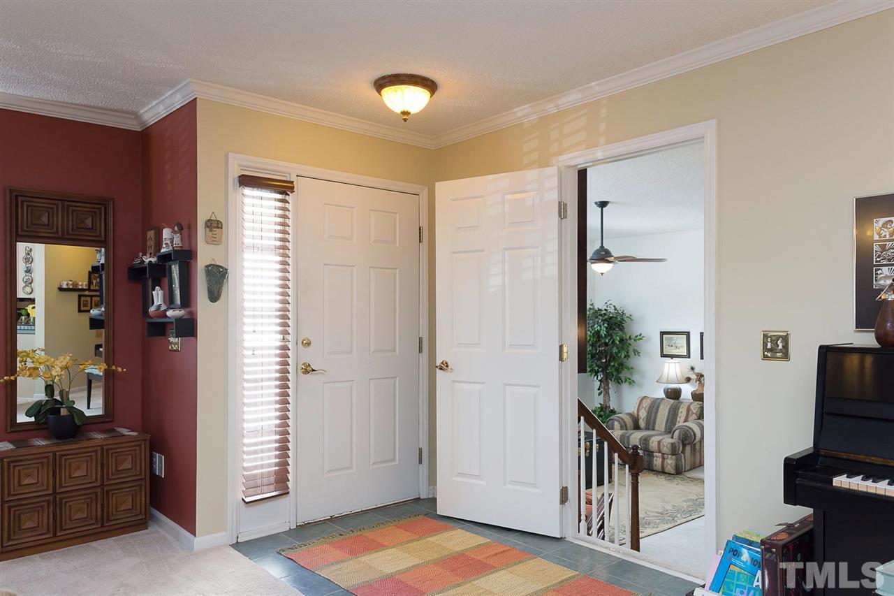 4529 Moss Spring Drive Raleigh, NC 27616 - Photo 2 of 21 a view of a livingroom with a flat screen tv