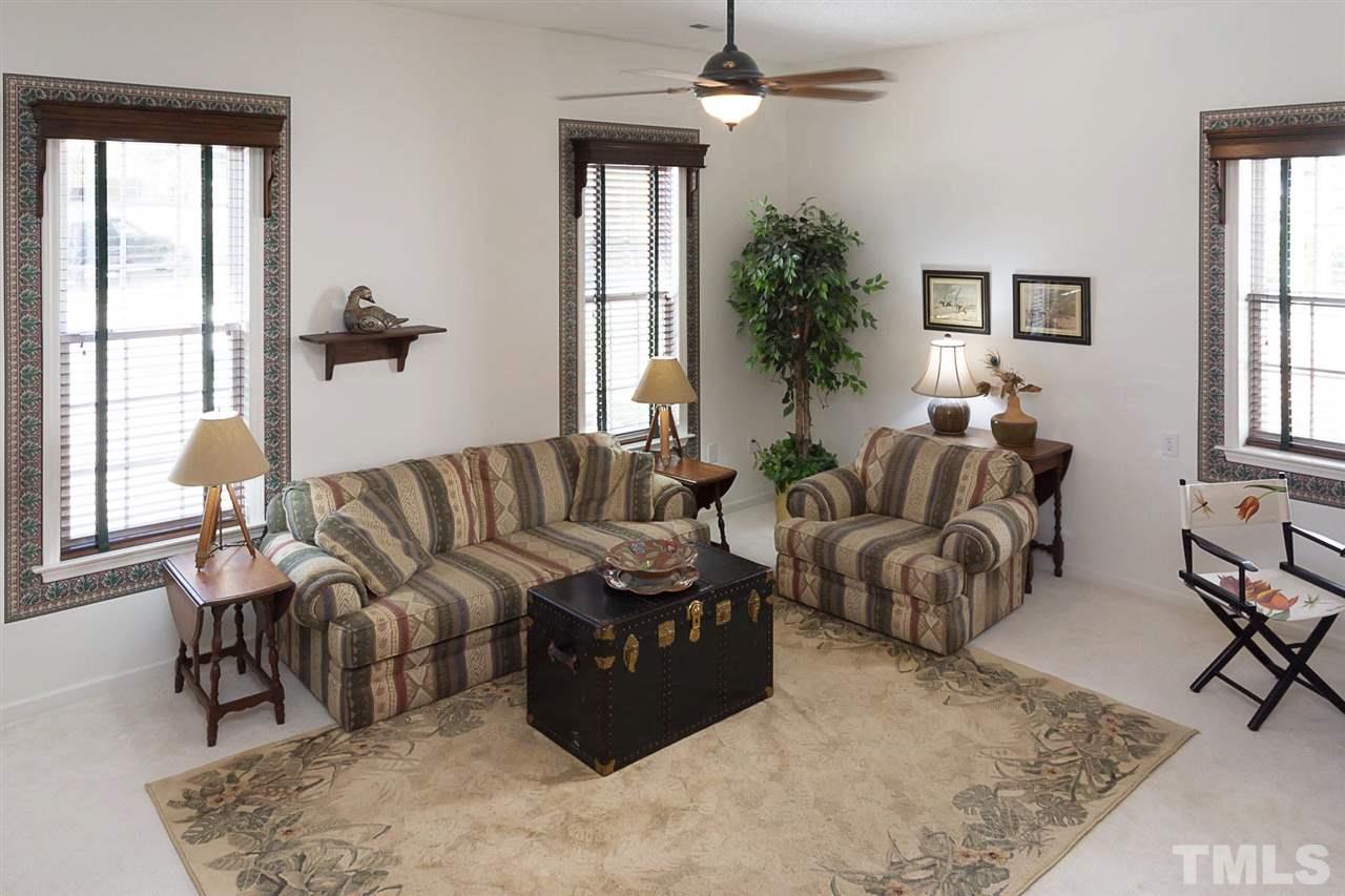 4529 Moss Spring Drive Raleigh, NC 27616 - Photo 16 of 21 a living room with furniture wooden floor and a large window