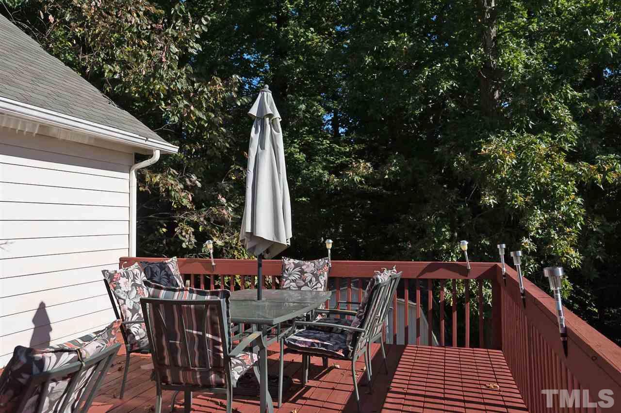 4529 Moss Spring Drive Raleigh, NC 27616 - Photo 19 of 21 a view of deck with furniture and trees