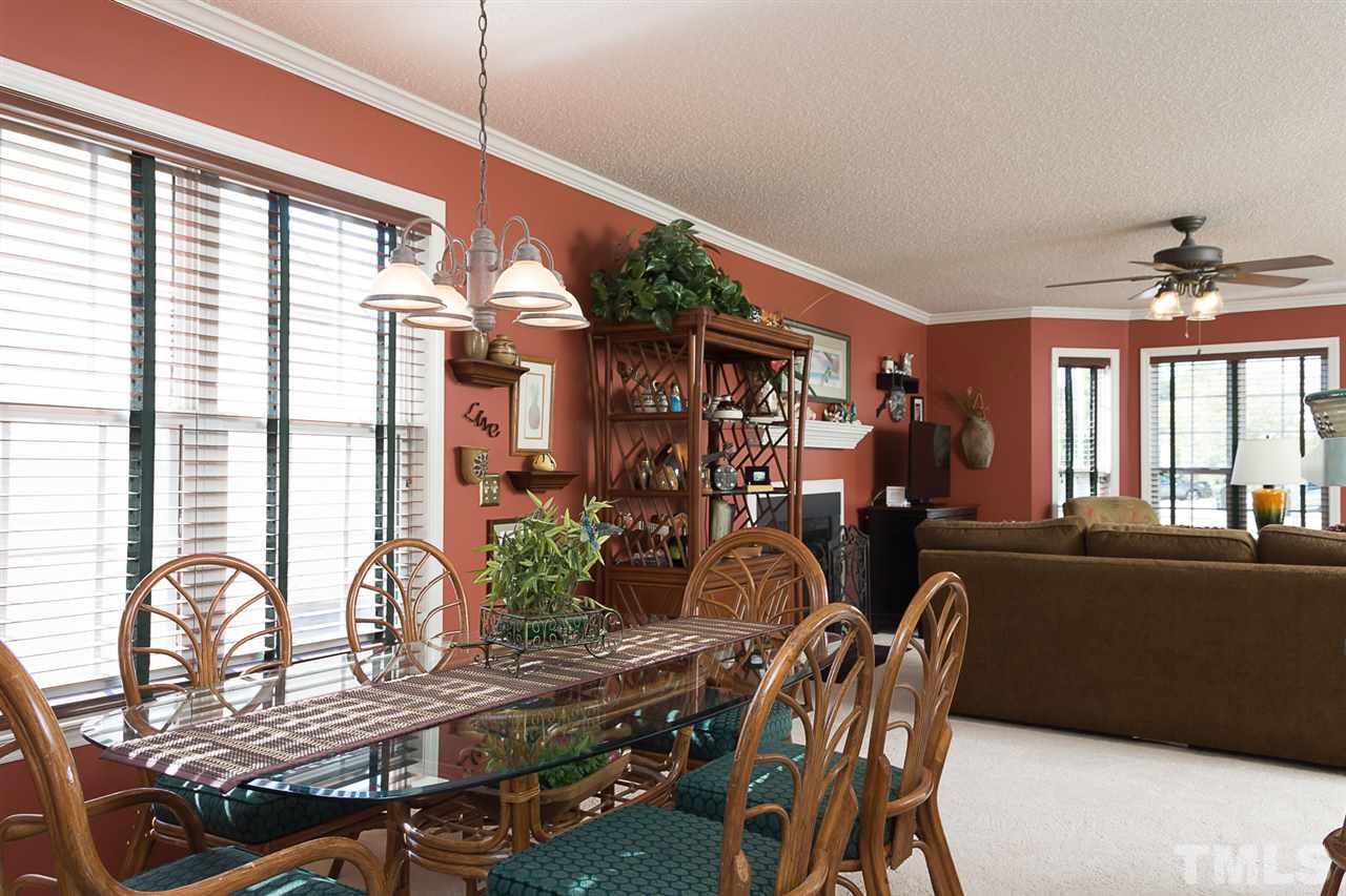 4529 Moss Spring Drive Raleigh, NC 27616 - Photo 7 of 21 a view of a dining room with furniture window and outside view