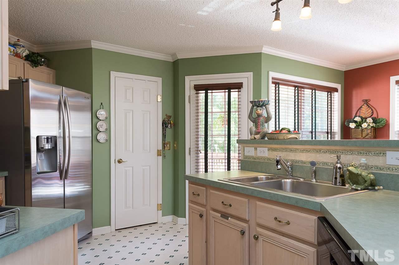 4529 Moss Spring Drive Raleigh, NC 27616 - Photo 9 of 21 a bathroom with a granite countertop sink and a mirror