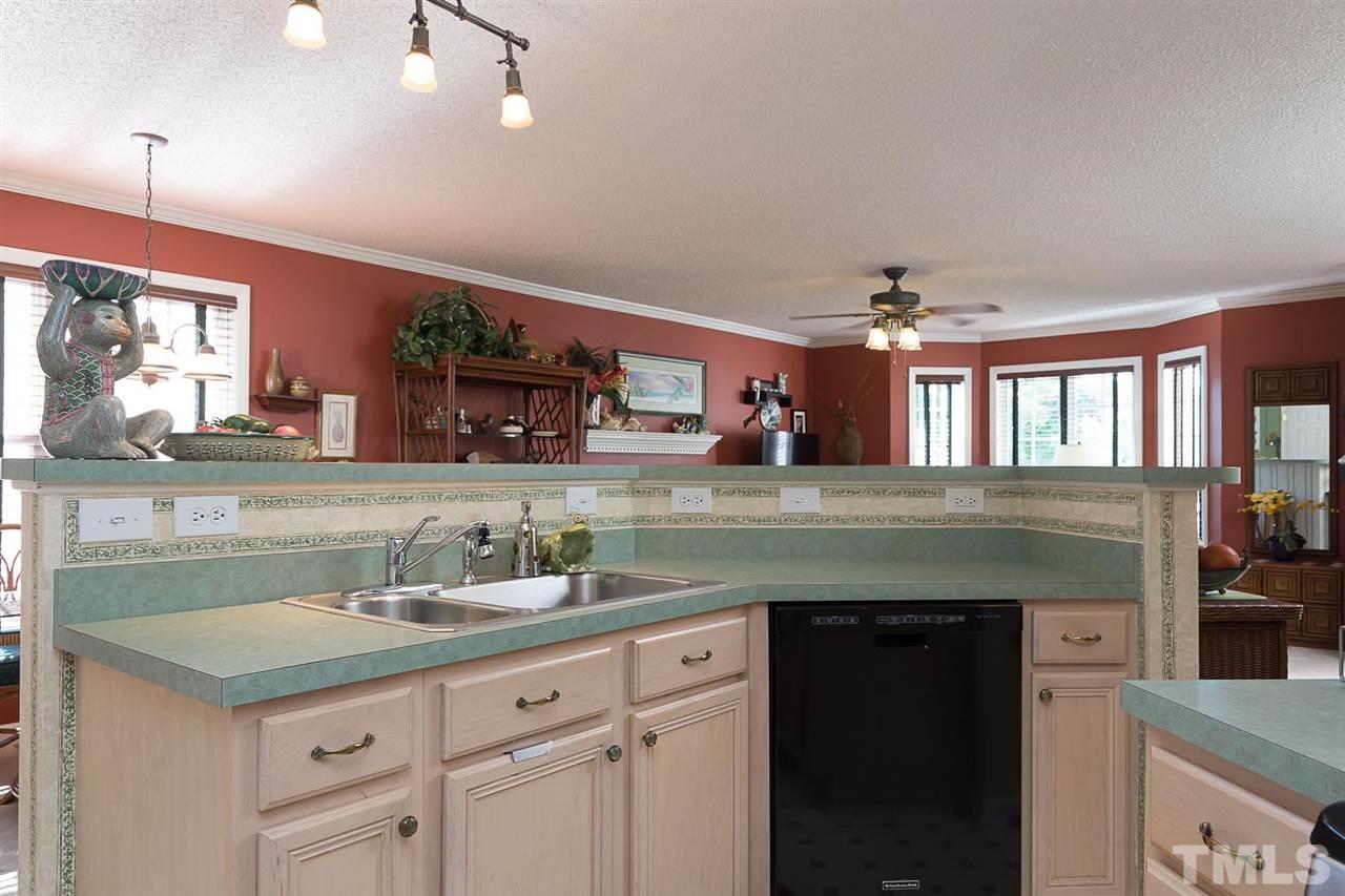 4529 Moss Spring Drive Raleigh, NC 27616 - Photo 10 of 21 a bathroom with a granite countertop sink a vanity and a large mirror