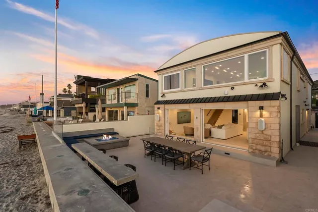 a front view of a house with outdoor seating