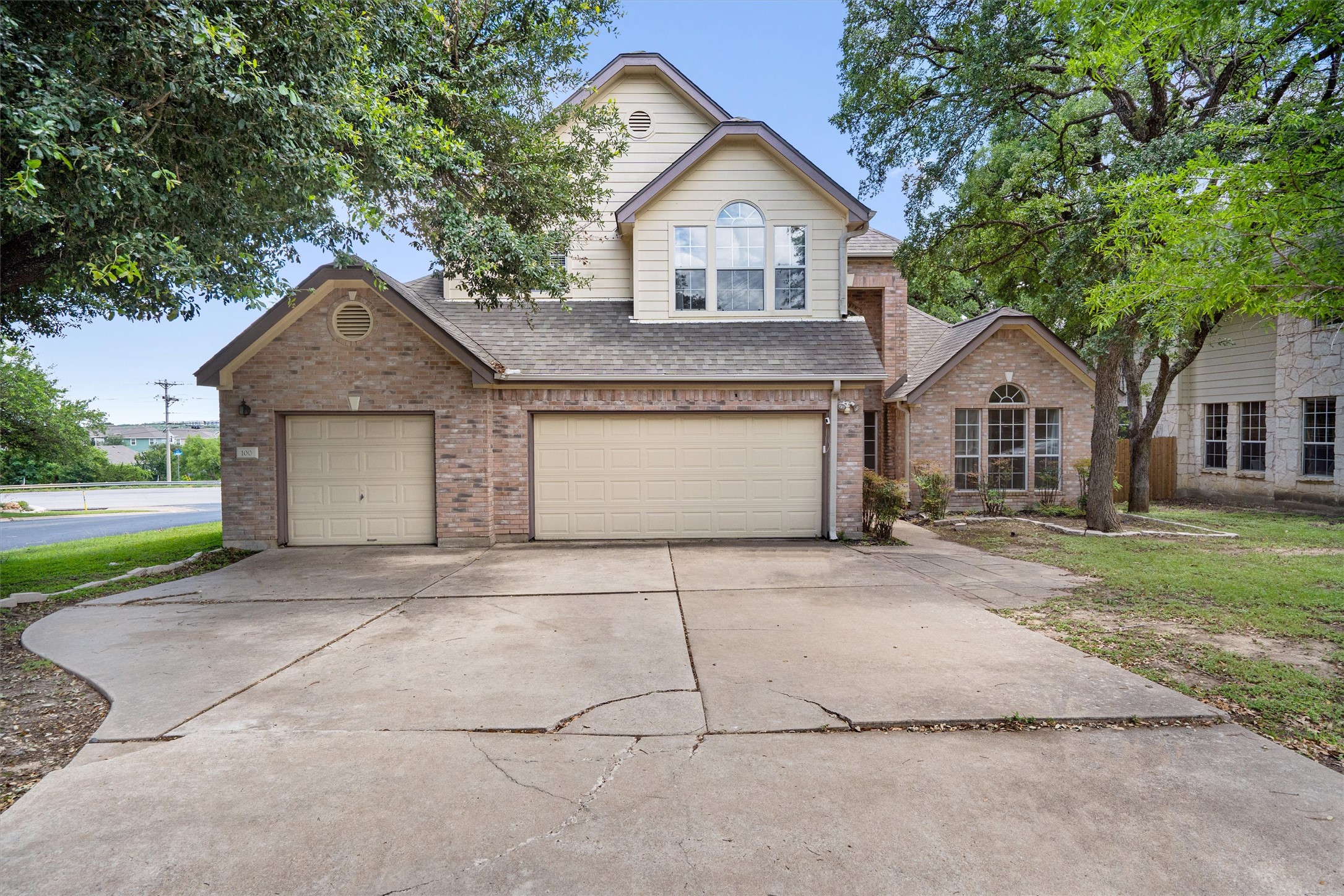 100 Parque Circle Georgetown, TX 78626 - Photo 2 of 39 a front view of a house with a yard and garage