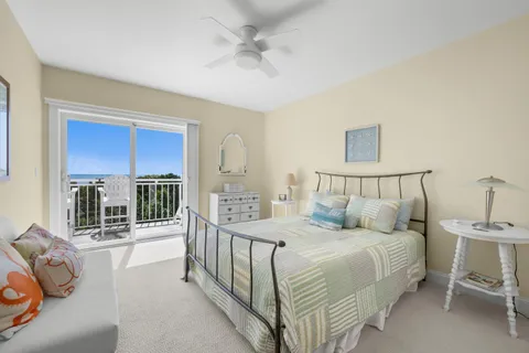 a bedroom with a balcony a bed and a couch