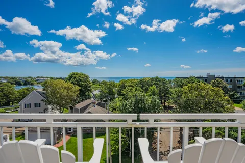 a view of a house with a flower garden