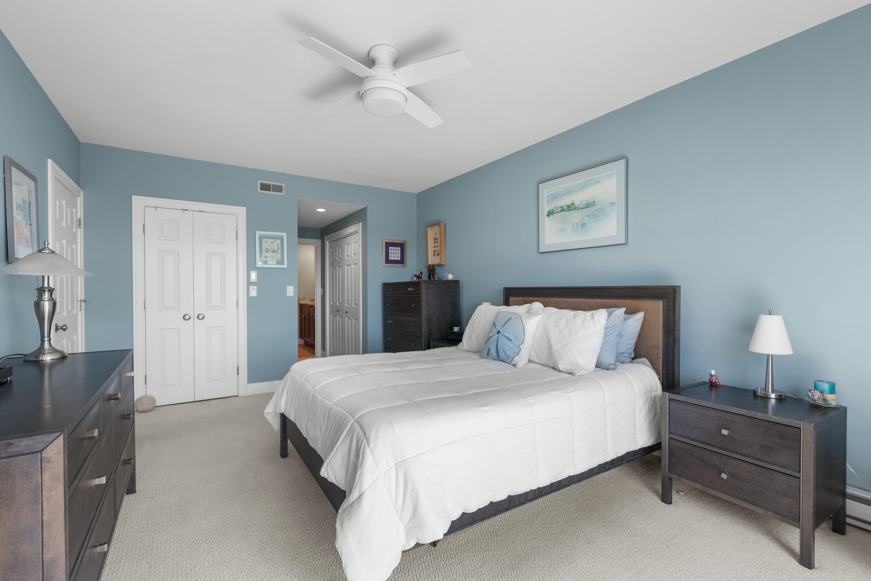 1 Belmont Road, Unit 542 West Harwich, MA 02671 - Photo 24 of 48 a bedroom with a bed and a chandelier