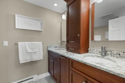 a bathroom with a toilet a sink and shower