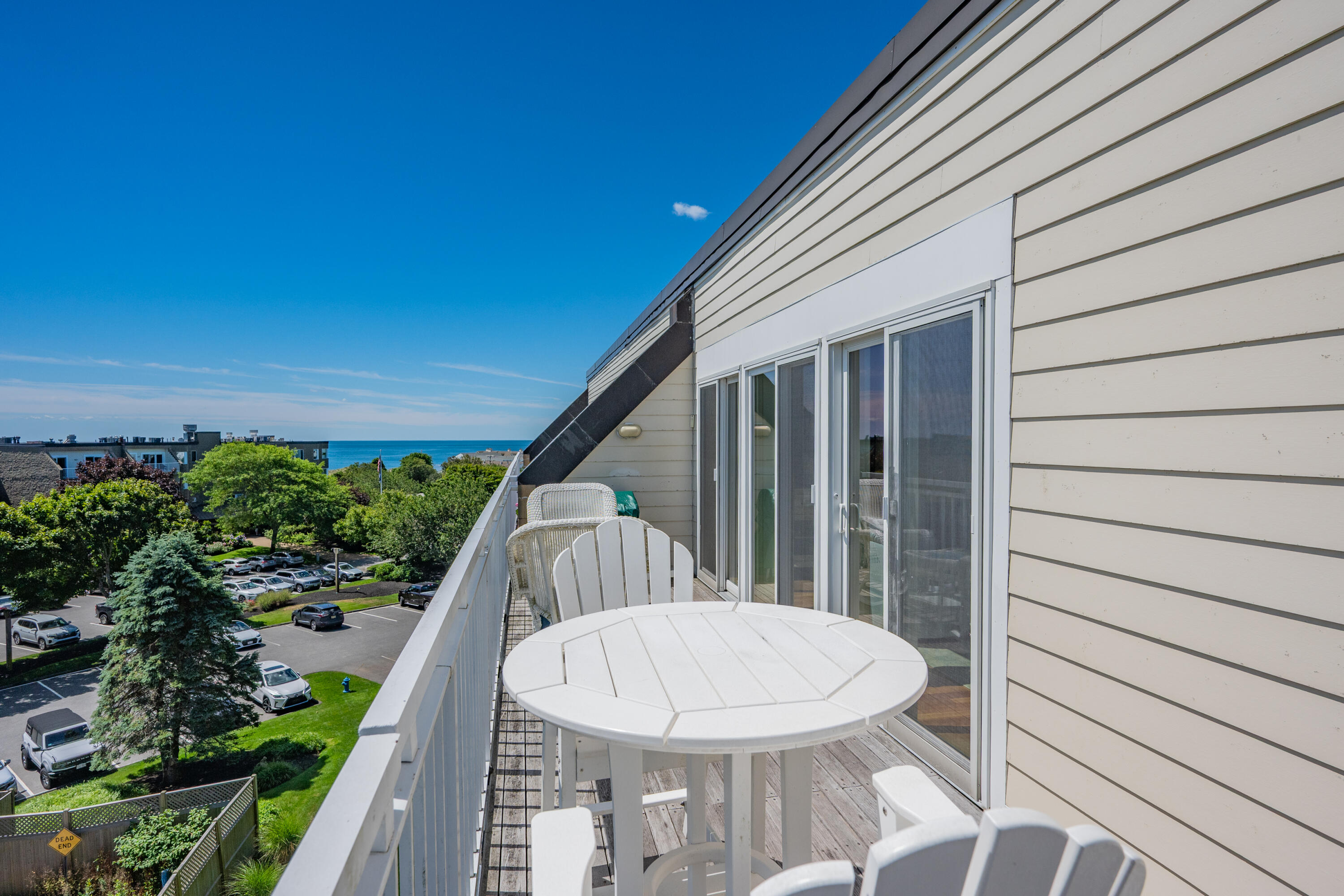 1 Belmont Road, Unit 542 West Harwich, MA 02671 - Photo 29 of 48 a view of a balcony with wooden floor and outdoor seating
