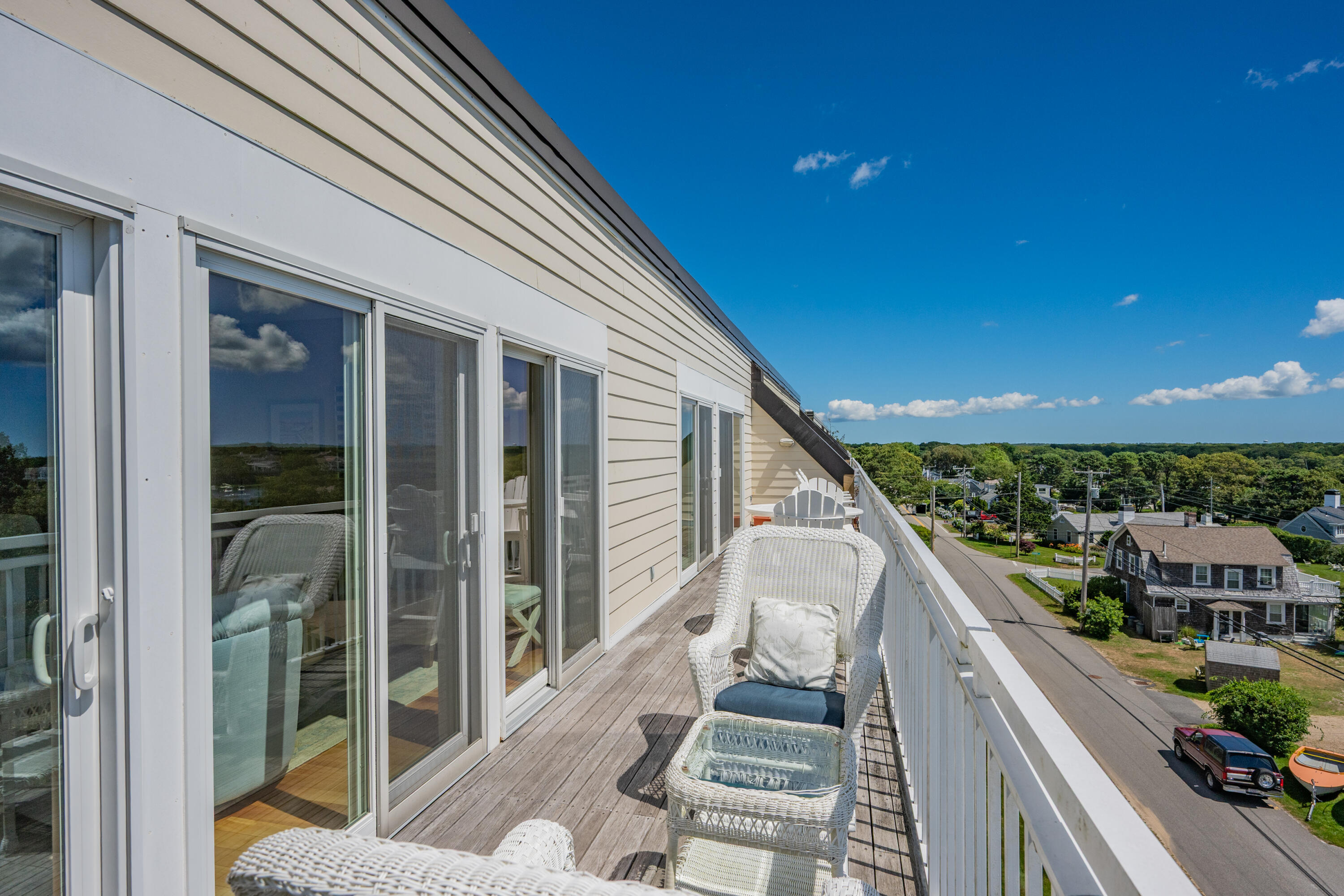 1 Belmont Road, Unit 542 West Harwich, MA 02671 - Photo 30 of 48 a balcony with wooden floor and outdoor view