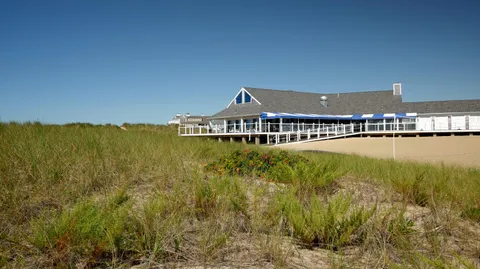a view of a balcony with wooden floor and outdoor space