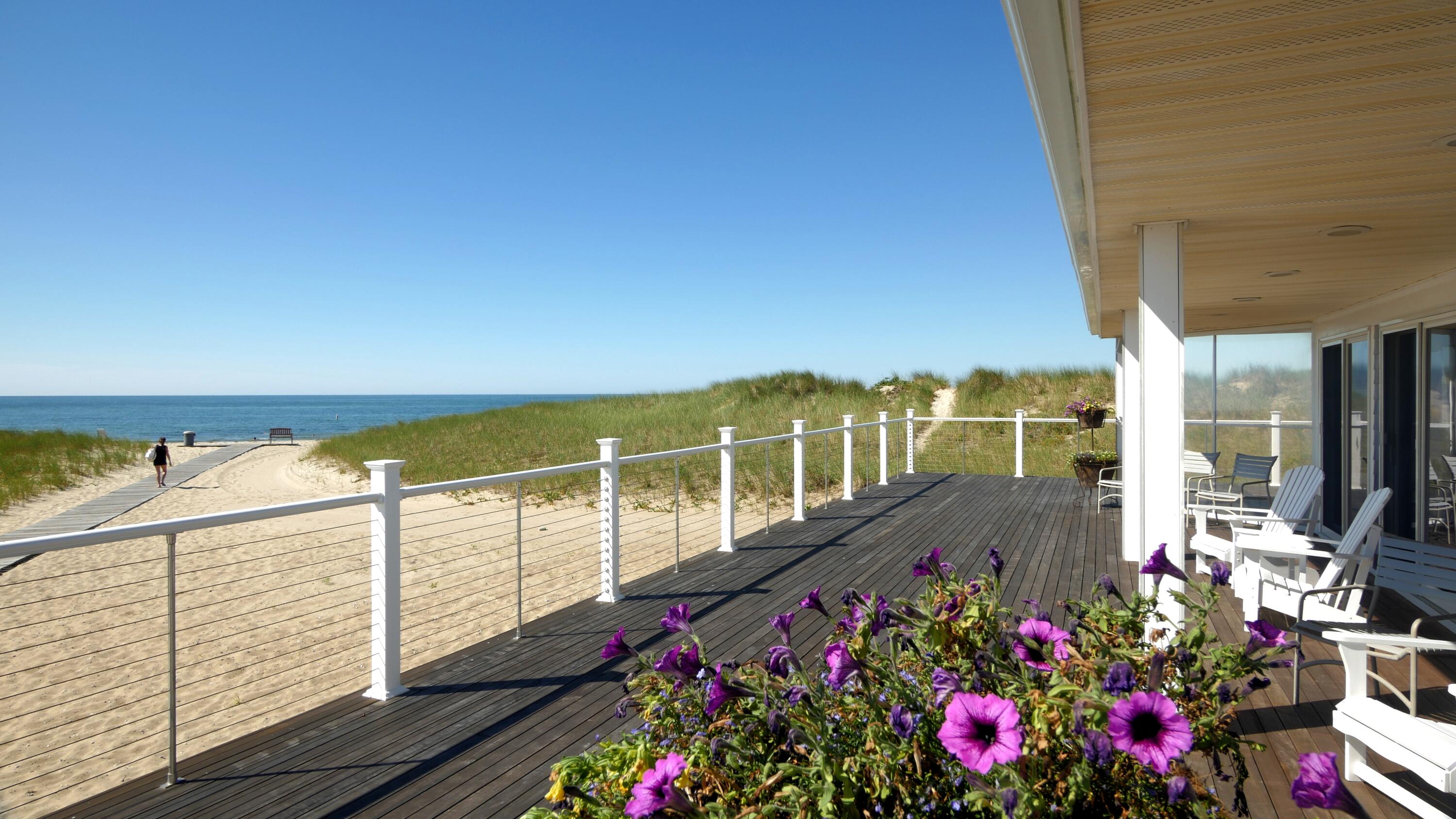 1 Belmont Road, Unit 542 West Harwich, MA 02671 - Photo 37 of 48 a view of a balcony with wooden floor and outdoor space