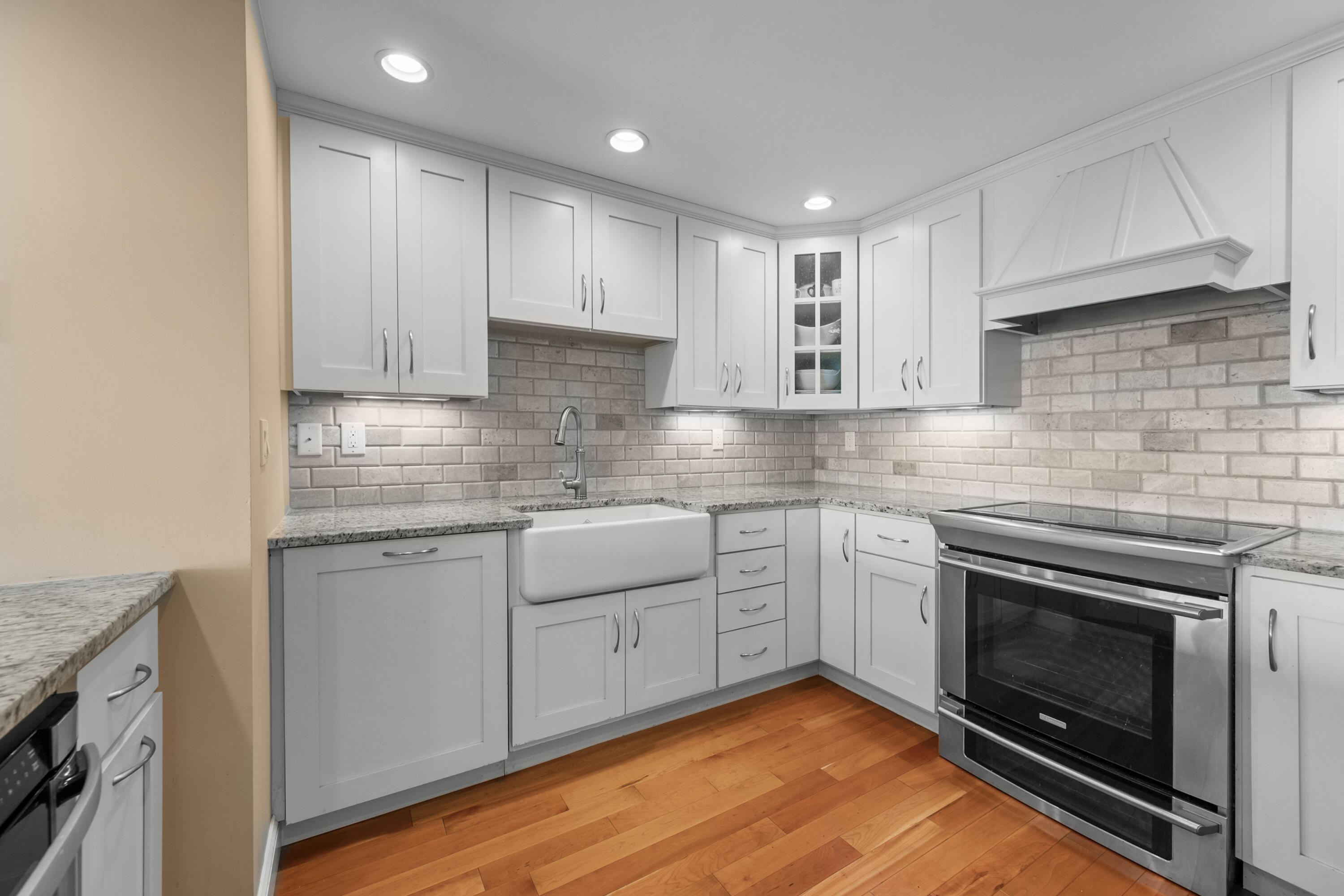 1 Belmont Road, Unit 542 West Harwich, MA 02671 - Photo 9 of 48 a kitchen with stainless steel appliances granite countertop a stove sink and cabinets