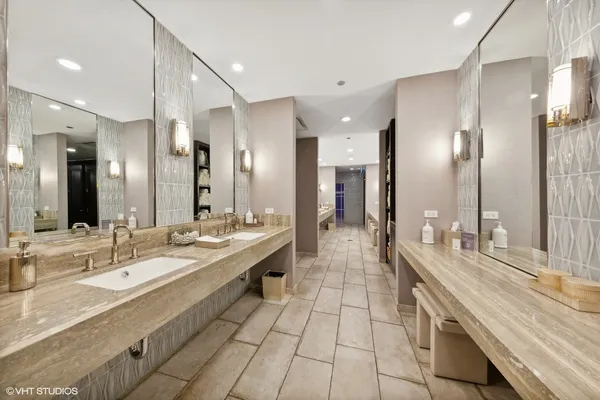 a large bathroom with a double vanity sink and a mirror