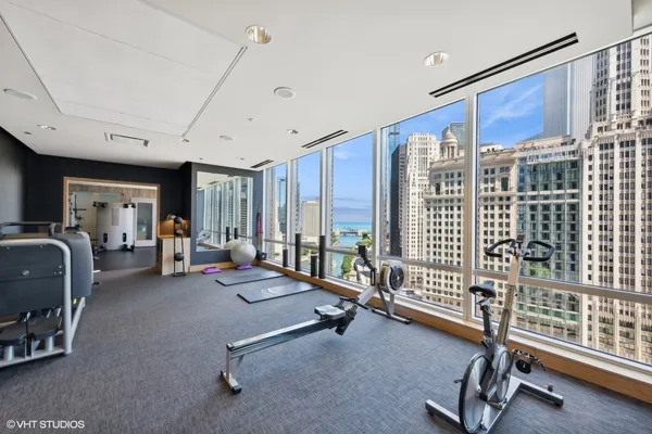 a room with gym equipment and large window