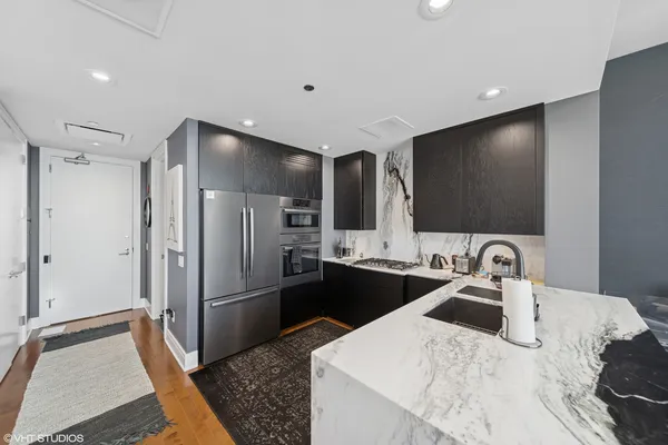 a kitchen with a sink and refrigerator